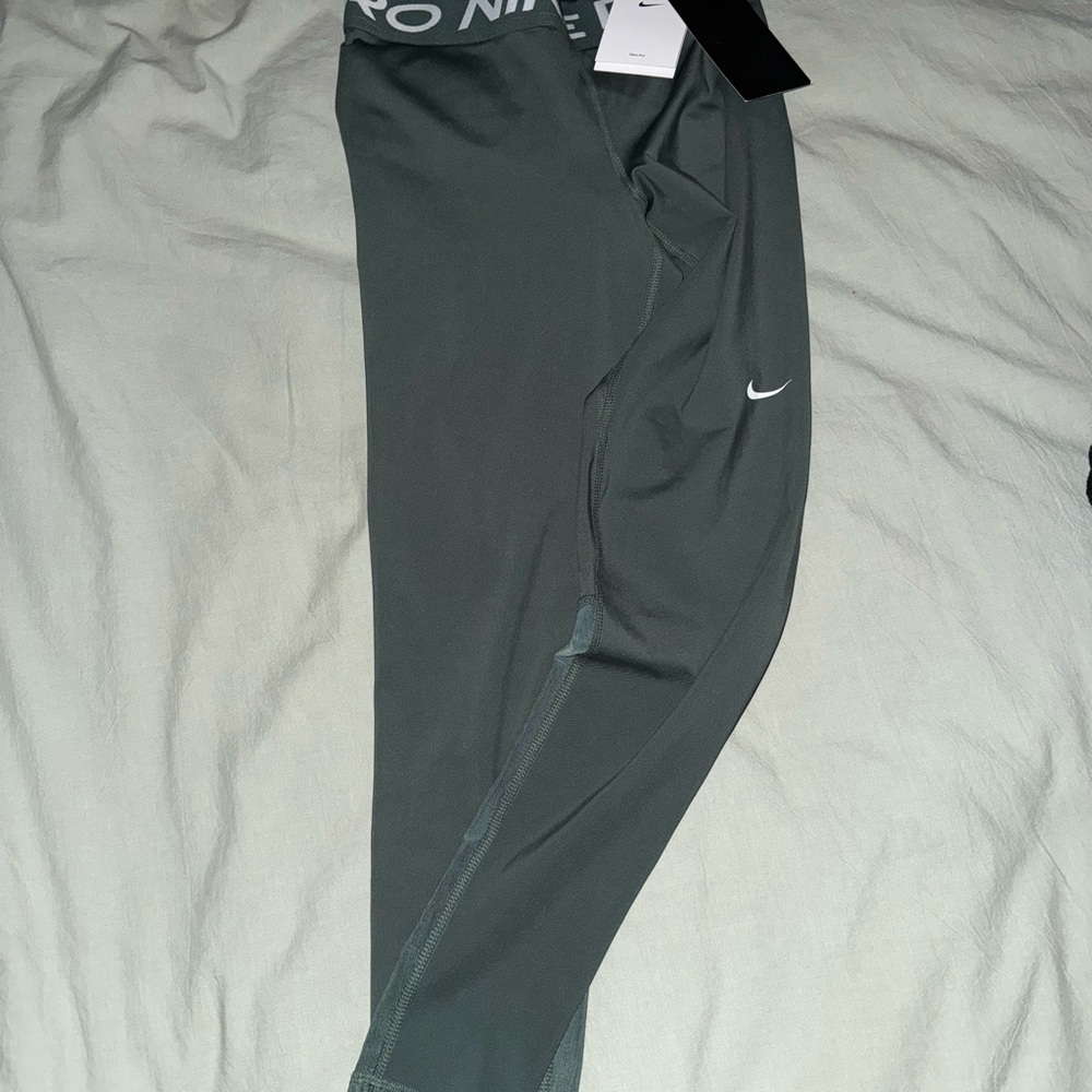 Nike Mid Rise Mesh Panel Leggings. Vintage green